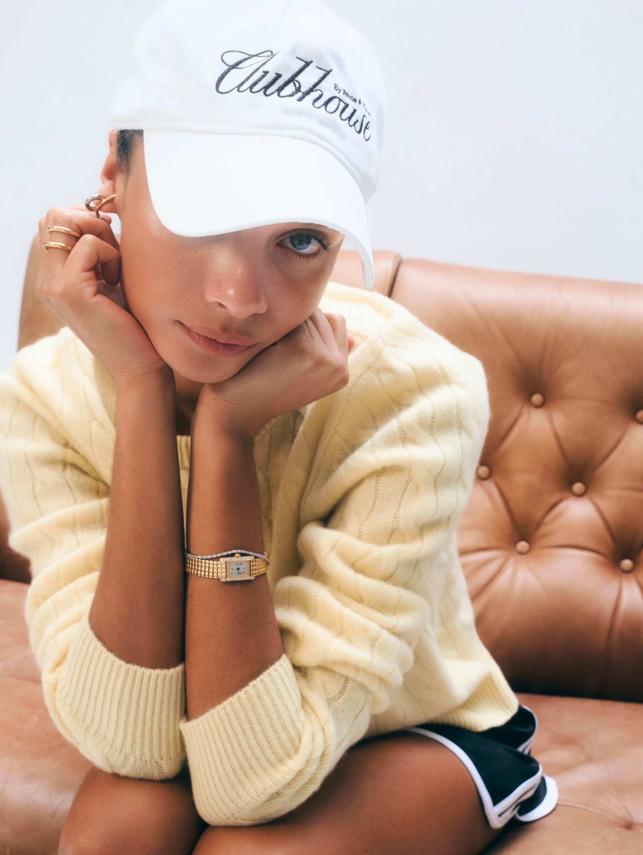 Model in a lemonade yellow cashmere varsity cable crewneck.