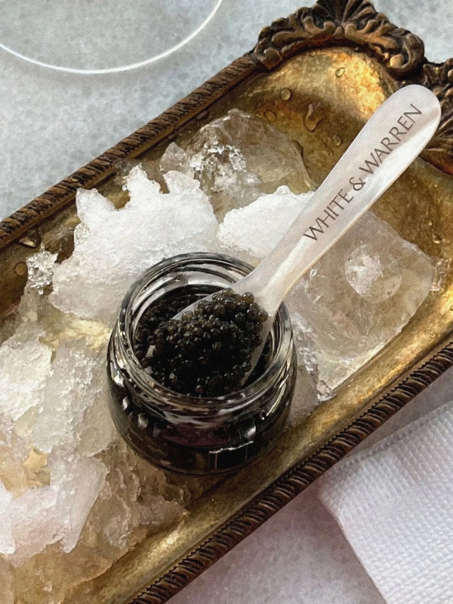 Caviar service styled on a club table.