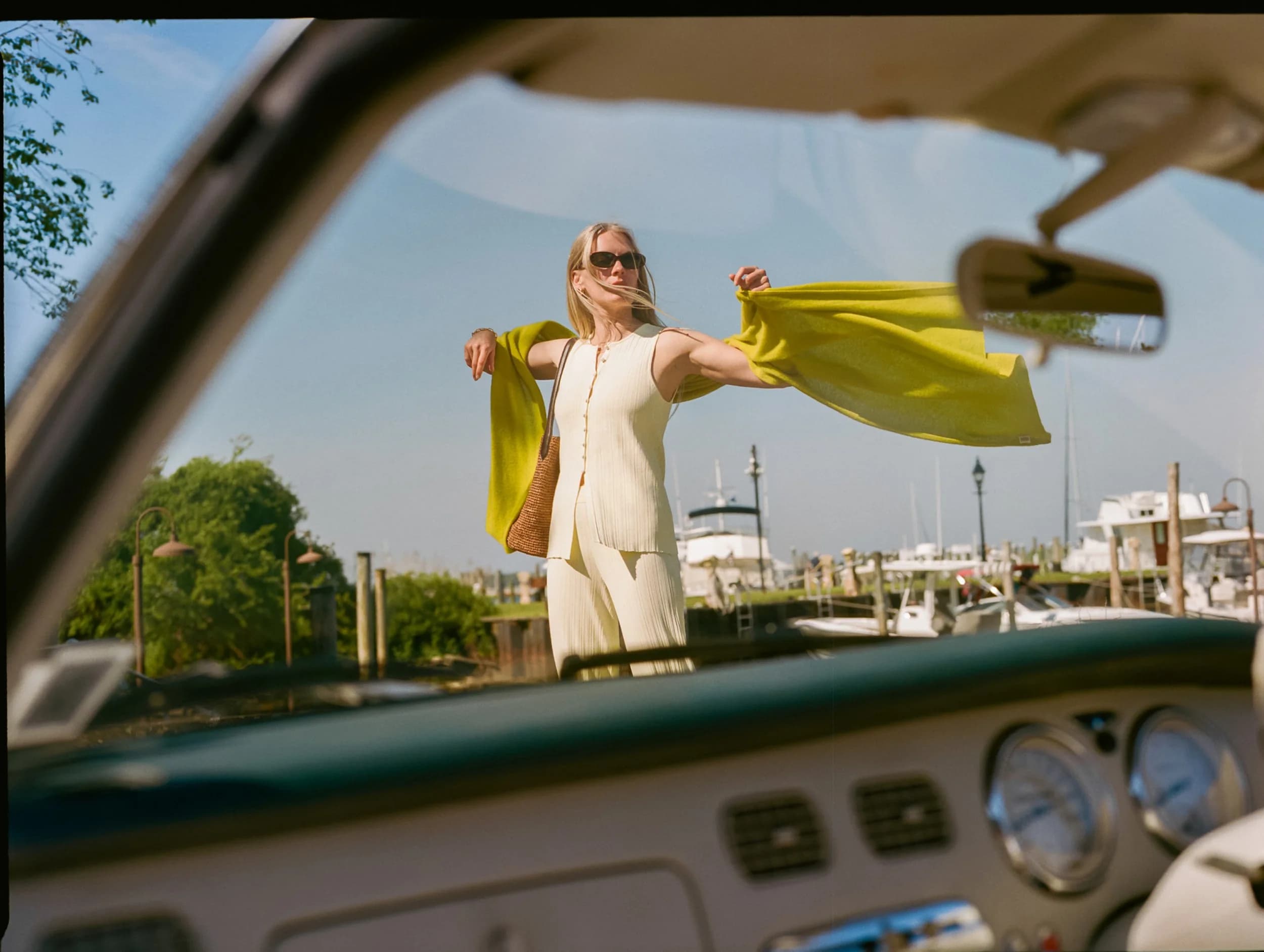 Model in a frosted lemon viscose vest and trousers with a citronelle cashmere travel wrap.